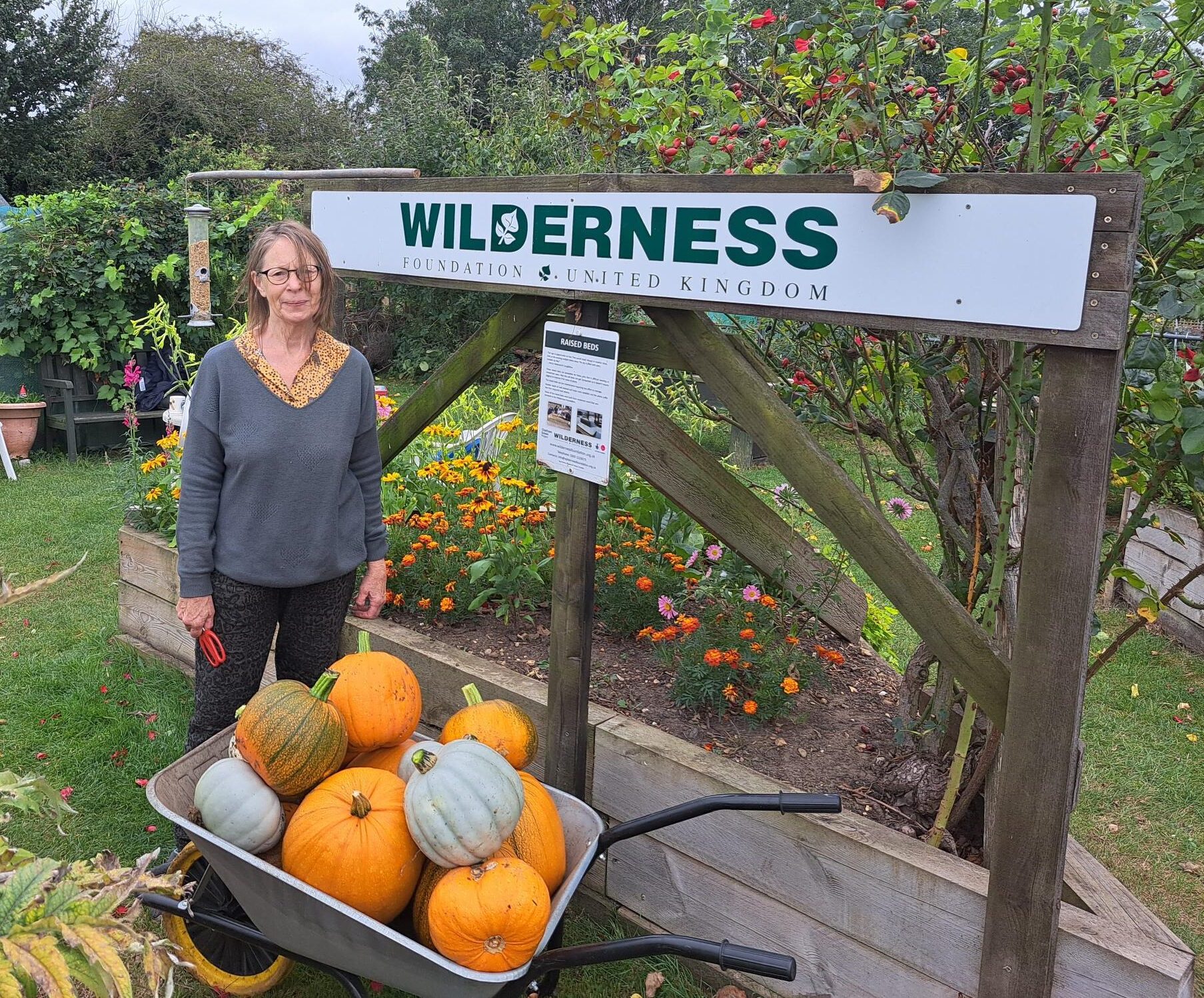 Andrea, pumpkins and sign